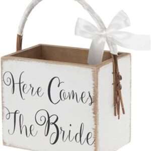Make your day extra special and sweet with Here Comes The Bride Wood Basket. Made of MDF wood, this darling box basket offers a painted white finish, "here comes the bride" in black text, and a satin ribbon wrapped around the vine handle. Fill it with flower petals for your sweet little flower girl to walk down the aisle with!