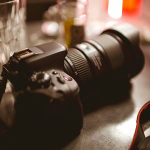 Shallow focus of a modern digital camera on a cafe table
