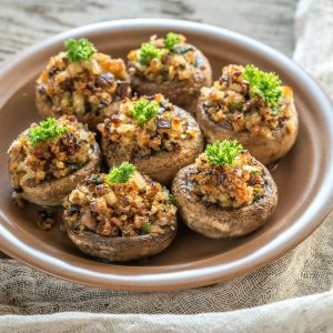 Mushrooms' caps stuffed with mixture of cheese, onion, breadcrum