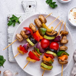 Vegetarian skewers with different grilled vegetables.