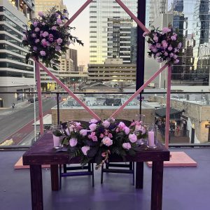 Geometric Arch with Floral Arrangements and Sweetheart Table